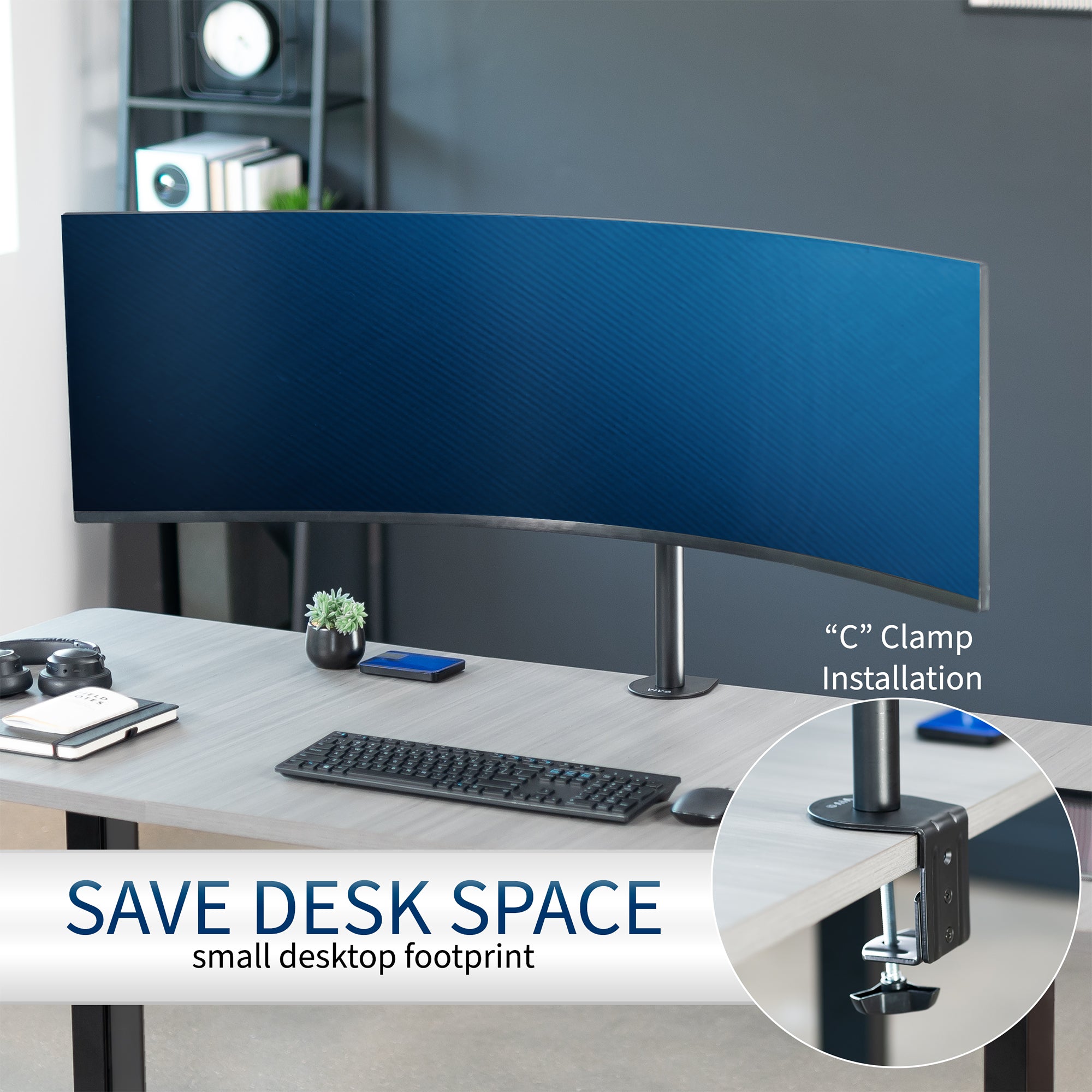 Single ultrawide monitor desk mount in an office setting saves desk space.