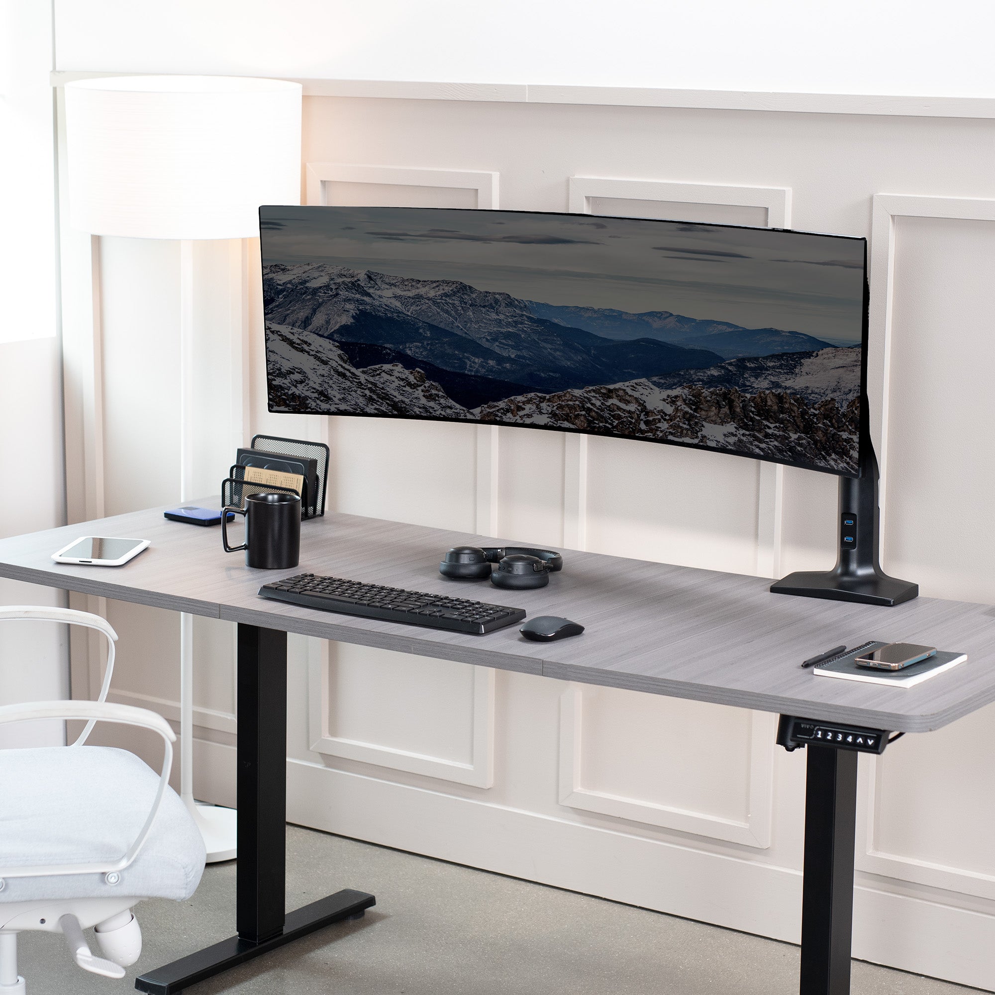 Sturdy adjustable pneumatic arm single ultrawide monitor ergonomic desk mount with USB ports for office workstation.