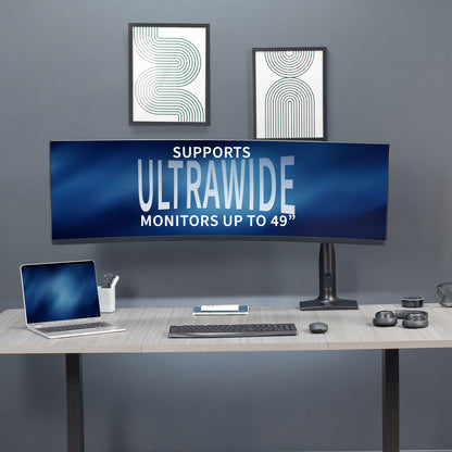 Ergonomic pneumatic arm with mounted ultrawide monitor.