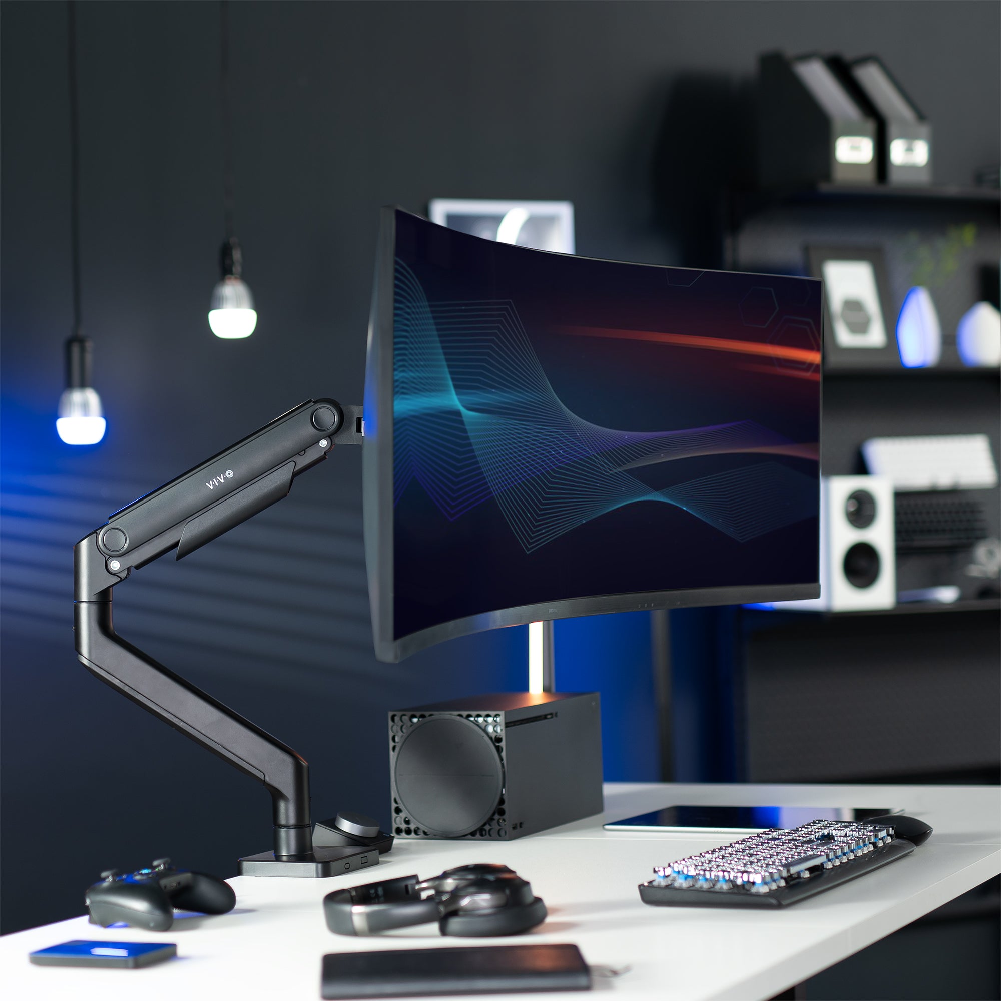 A single ultrawide computer monitor attached to a pneumatic arm desk mount.