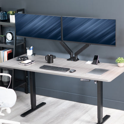 Adjustable pneumatic dual monitor desk mount with USB ports for ultrawide monitors.