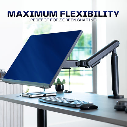 Flexible monitor arm on a desk with text displaying flexibility. 