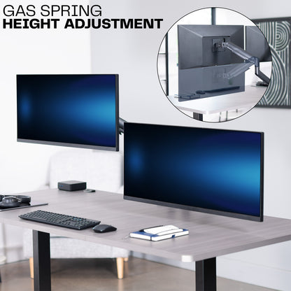 A dual monitor desk mount with pneumatic arms and a gas spring for height adjustments. 