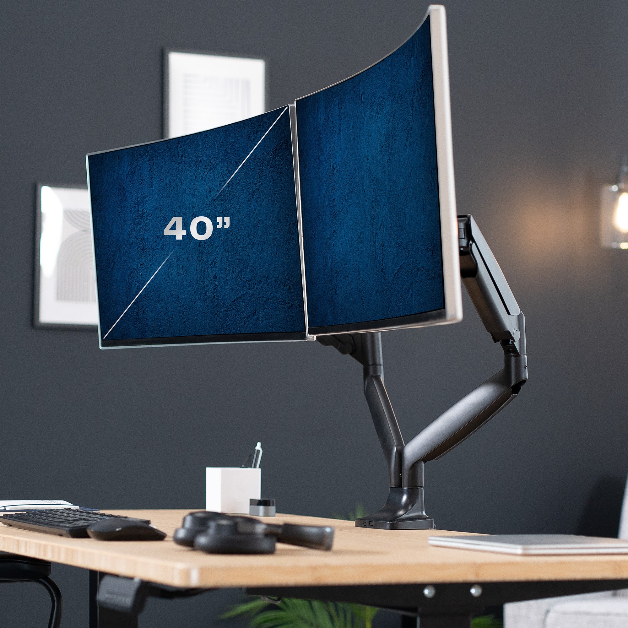 A dual ultrawide monitor desk mount with pneumatic arms. 