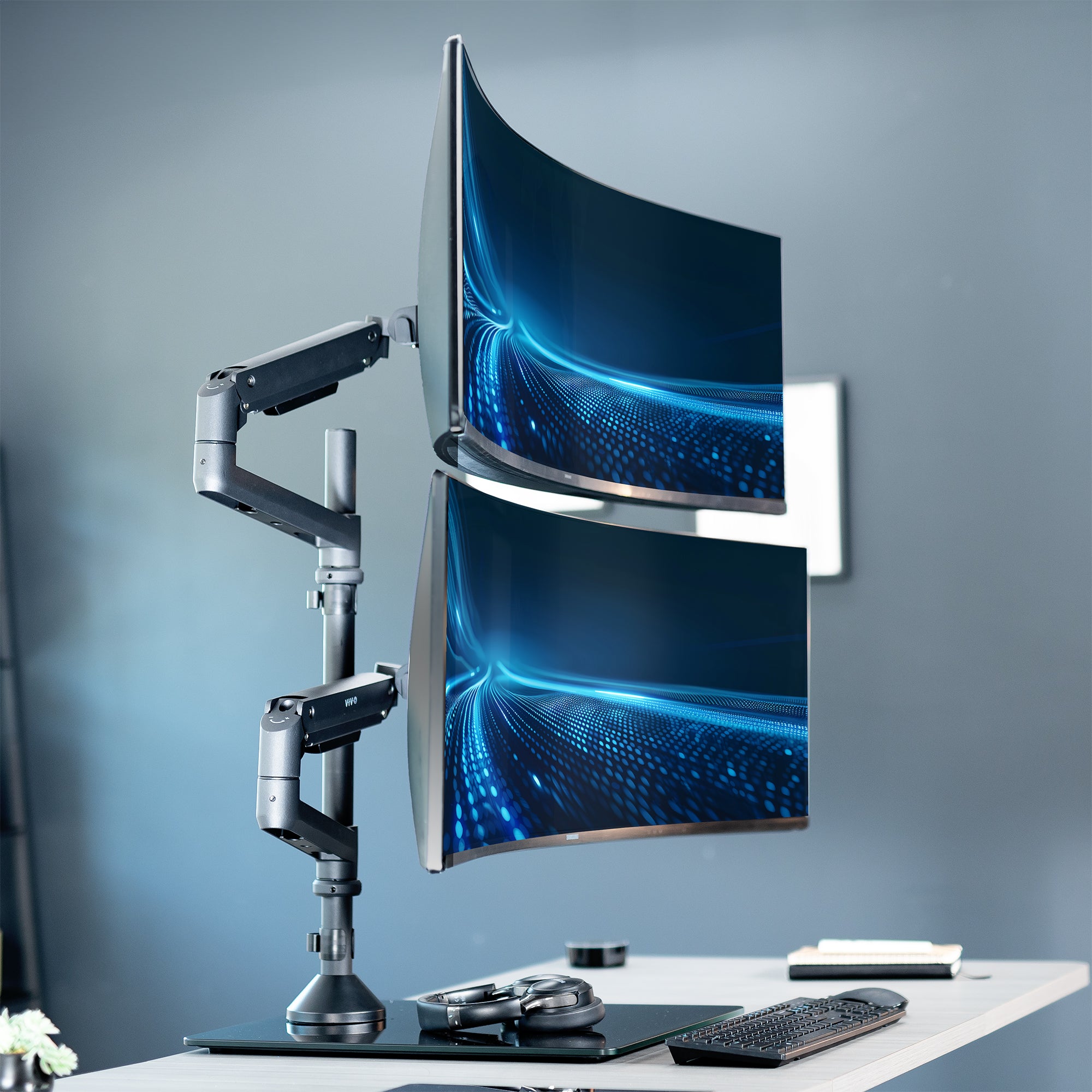 Heavy duty height adjustable dual ultrawide monitor stand with articulation and integrated cable management.