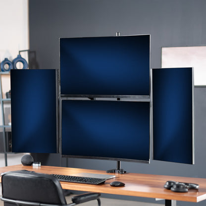 Computer setup with multiple monitors on a desk in a room.