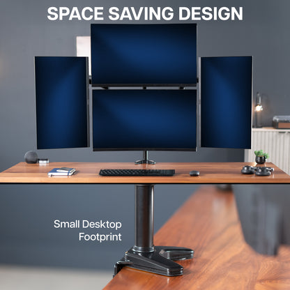 Space-saving computer setup with multiple monitors on a desk against a gray wall.