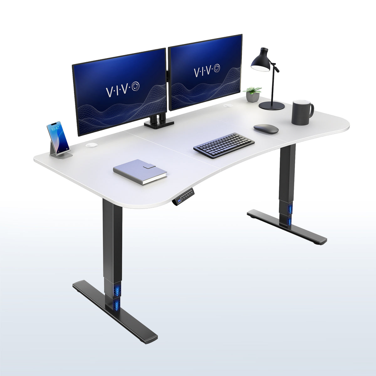 White top, black frame 63” x 32” Electric Height Adjustable Stand Up Desk. 
