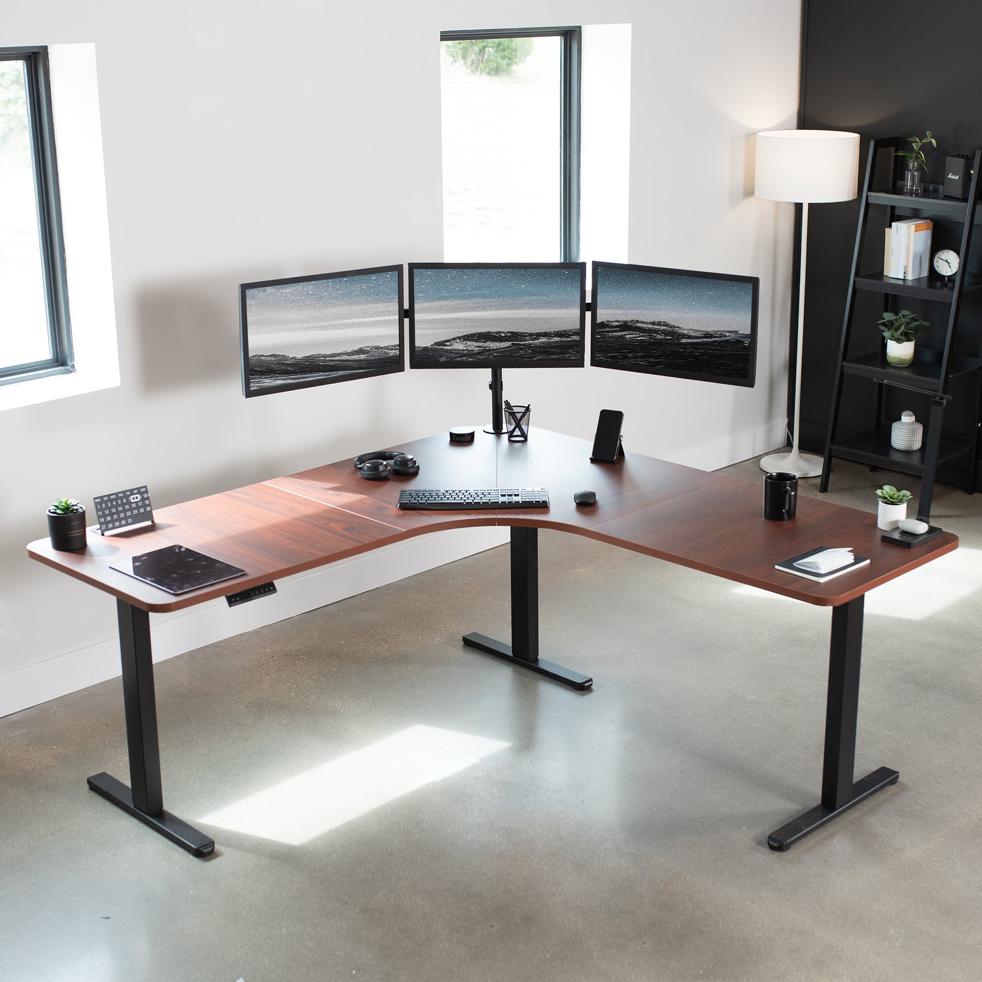 Large heavy-duty electric height adjustable corner desk workstation with programmable memory controller.