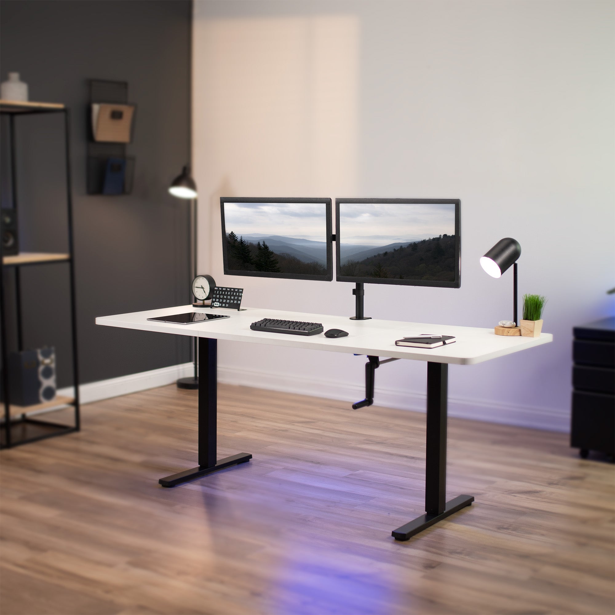 Wide surface sturdy sit or stand active workstation with adjustable height using manual hand crank.