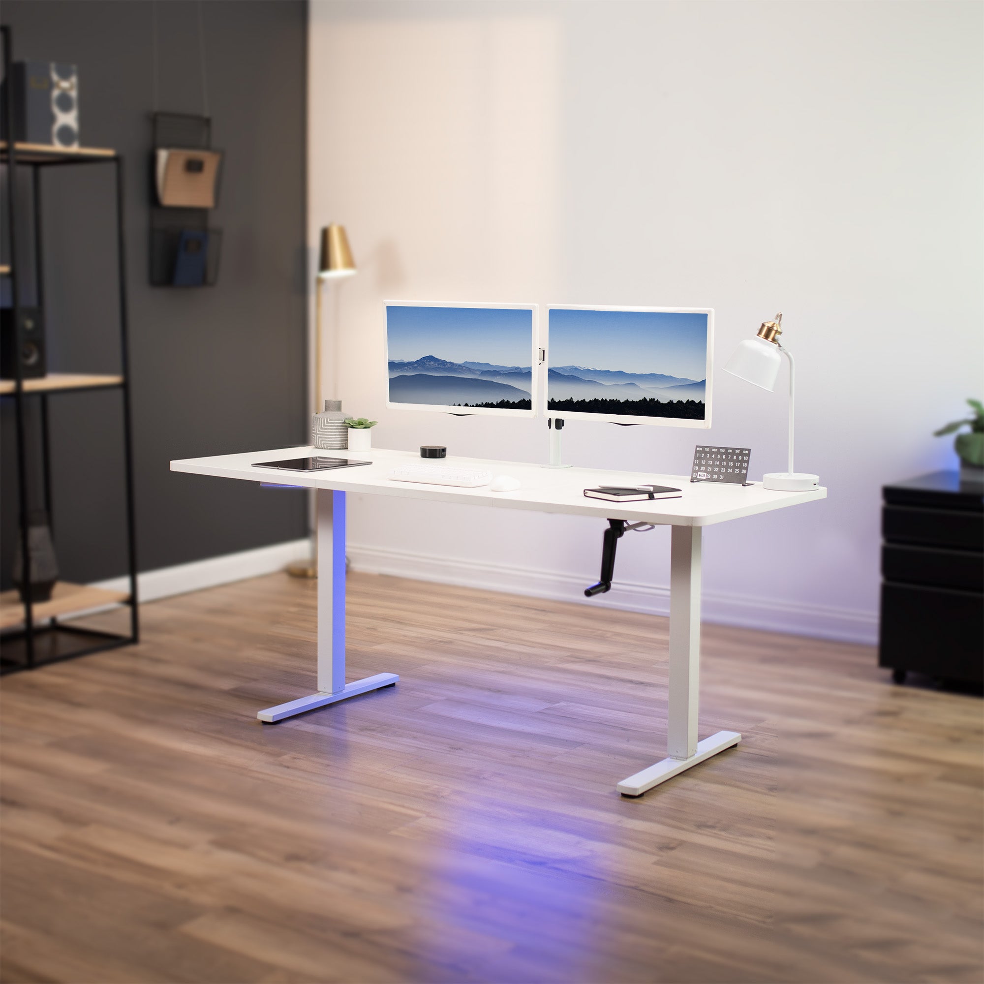 Wide surface sturdy sit or stand active workstation with adjustable height using manual hand crank.