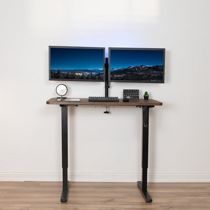 Height adjustable, non-electric sit-to-stand desk in minimalist office space.