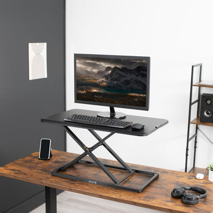  Desktop converter from VIVO supporting a monitor, mouse, and keyboard tray.