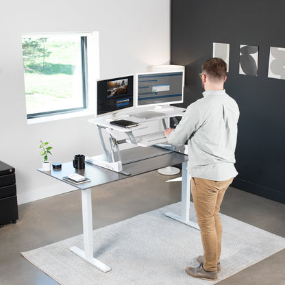 Heavy-duty height adjustable desk converter monitor riser with 2 tiers.