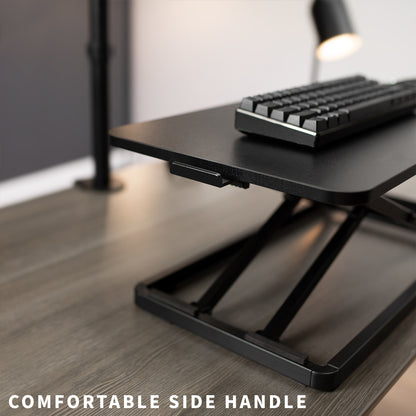 Low profile design of the side handle to adjust the desk riser.