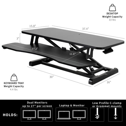 Dimension of the keyboard tray and desktop with a hefty weight holding a variety of office equipment pieces.