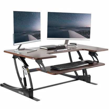 Heavy-duty height adjustable desk converter monitor riser with 2 tiers.