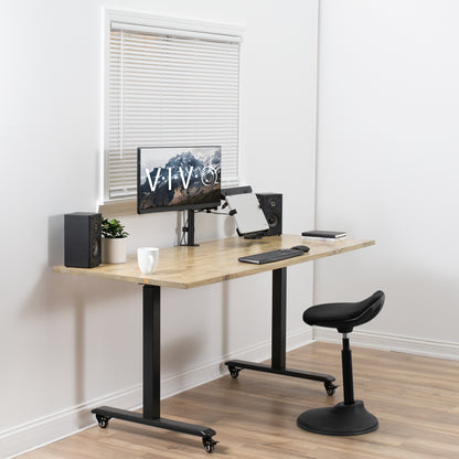 Live office space with an adjustable laptop stand arm.