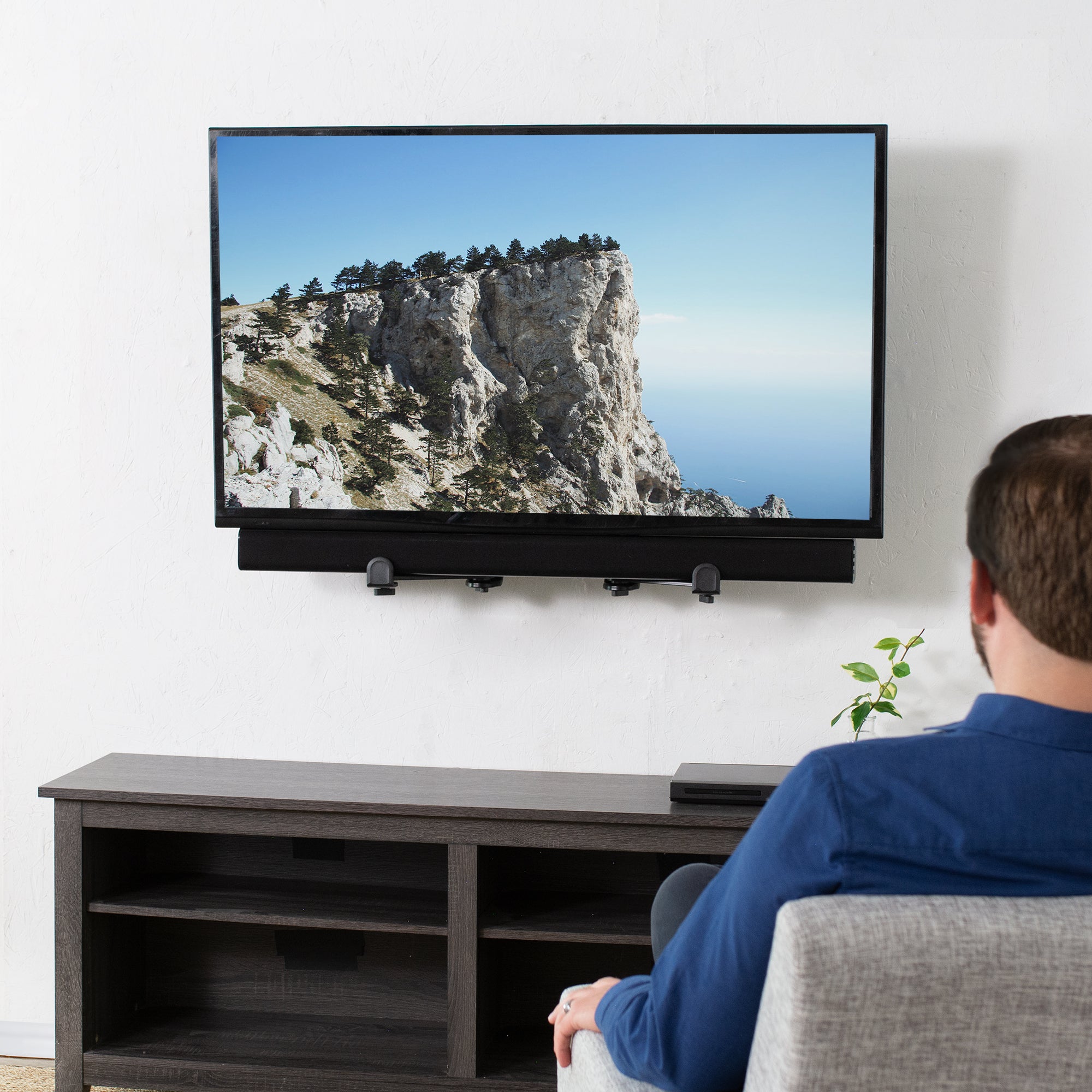 Below TV soundbar bracket setup.