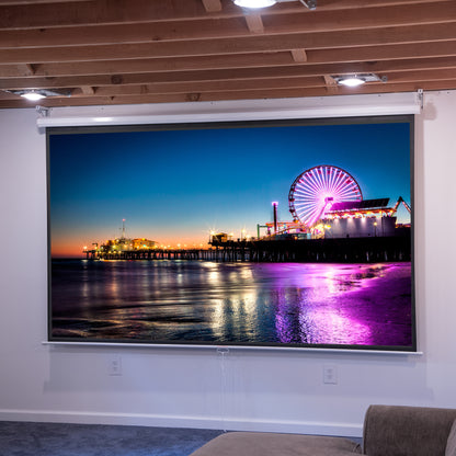 Night light cityscape on a projector hanging in a basement.