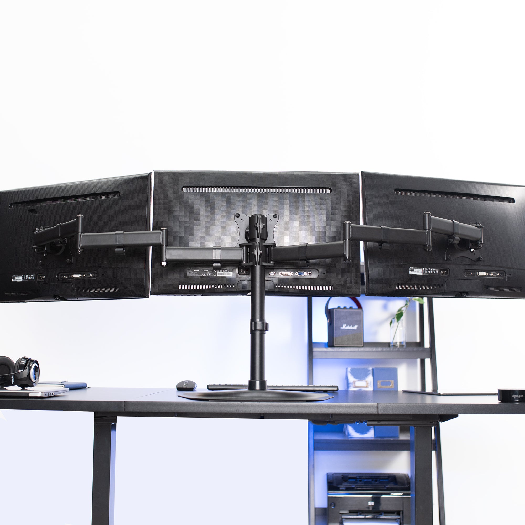 Sturdy height adjustable triple monitor desk stand.