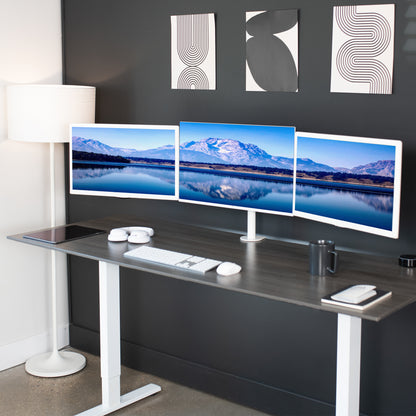 Sturdy height adjustable triple monitor desk mount.