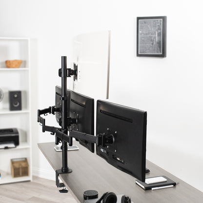 Sturdy height adjustable quad monitor desk stand.